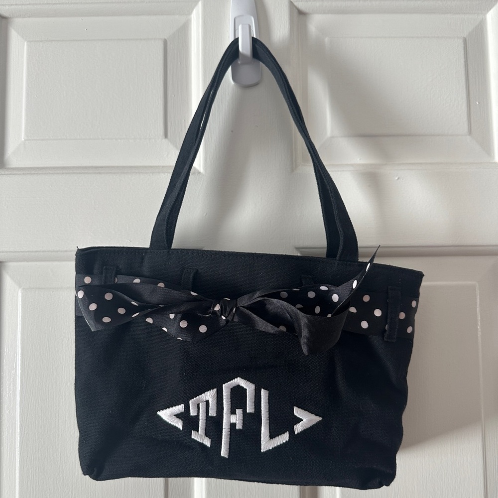 Black purse with TLF monogram